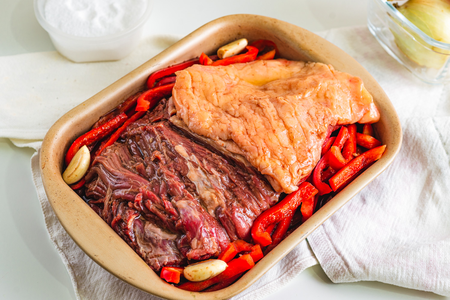 flank steak marinated with beer with veggies on a roaster