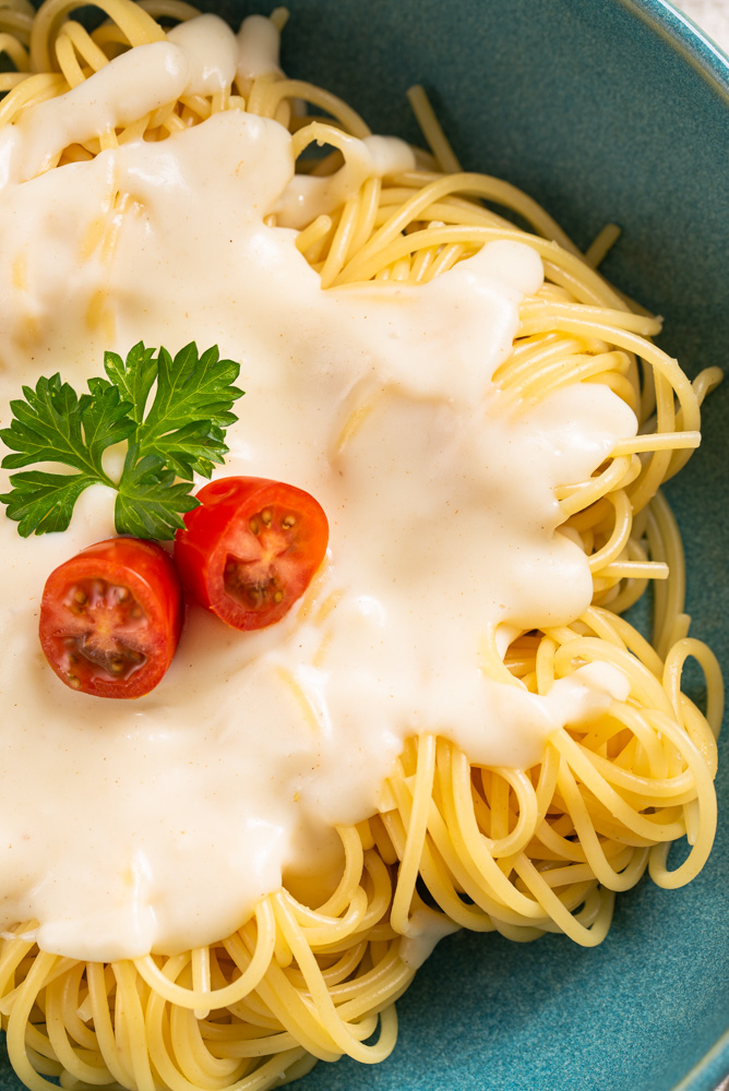 bechamel sauce over pasta