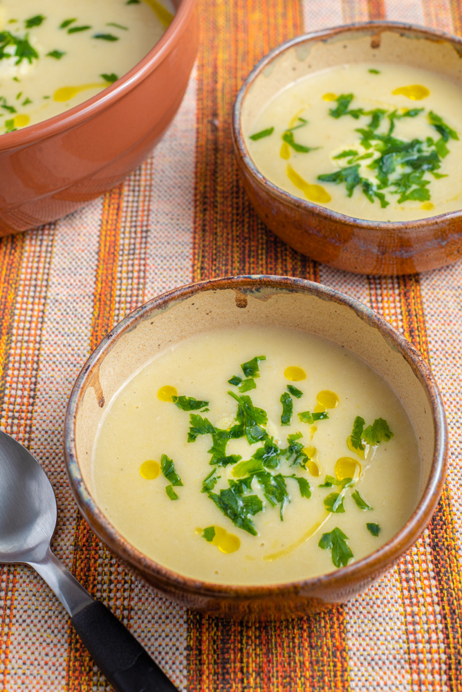 bowls of leek and potato soup on a table