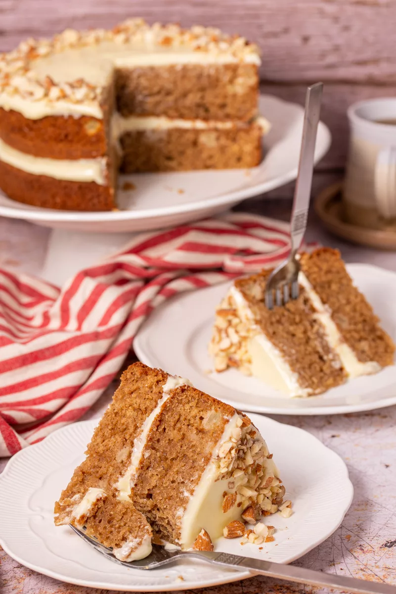 two slices of a layered spice cake in plates