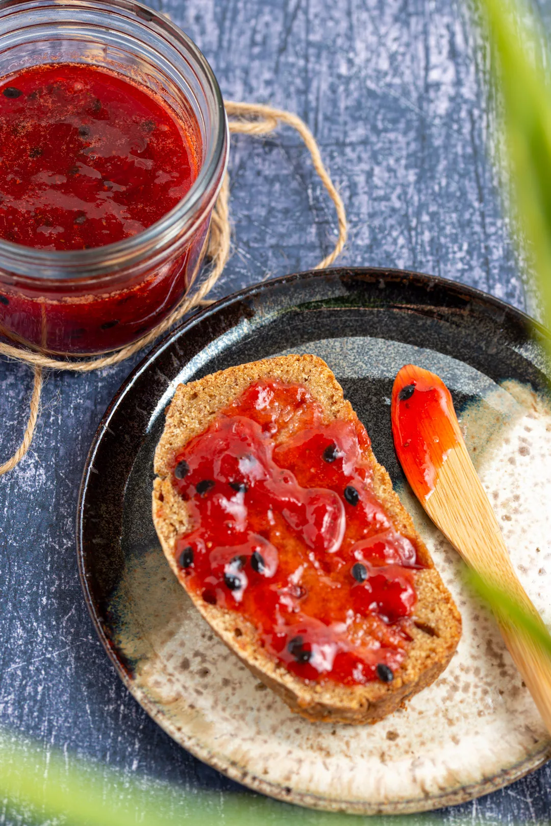 strawberry and passion fruit jam spread over a 