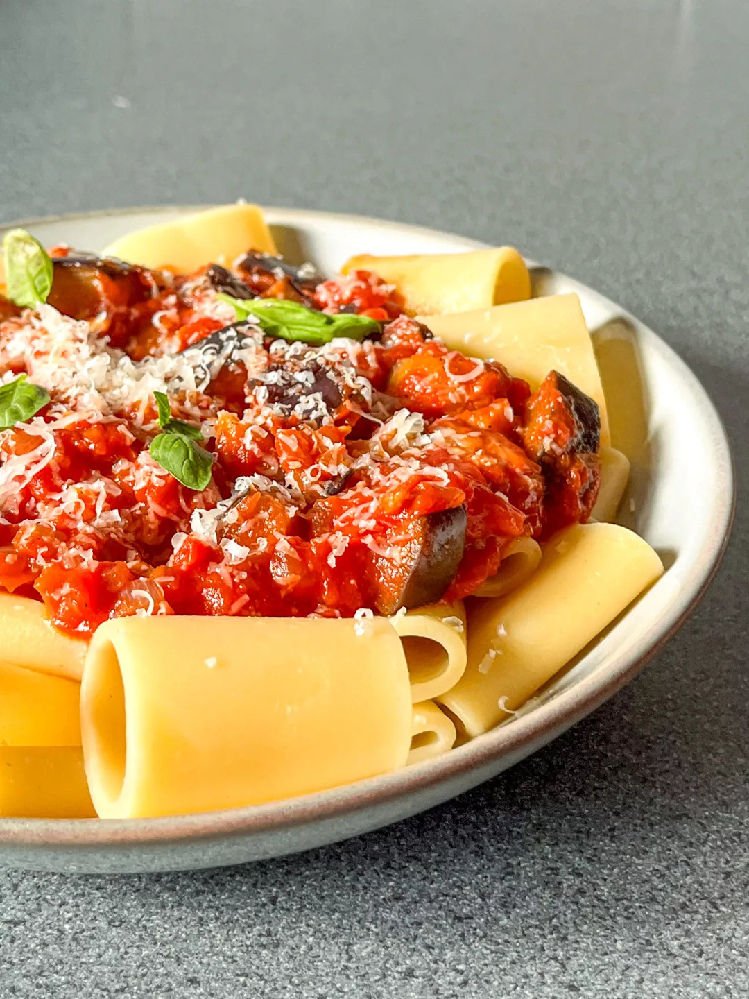 a bowl with paccheri pasta with eggpant tomato sauce