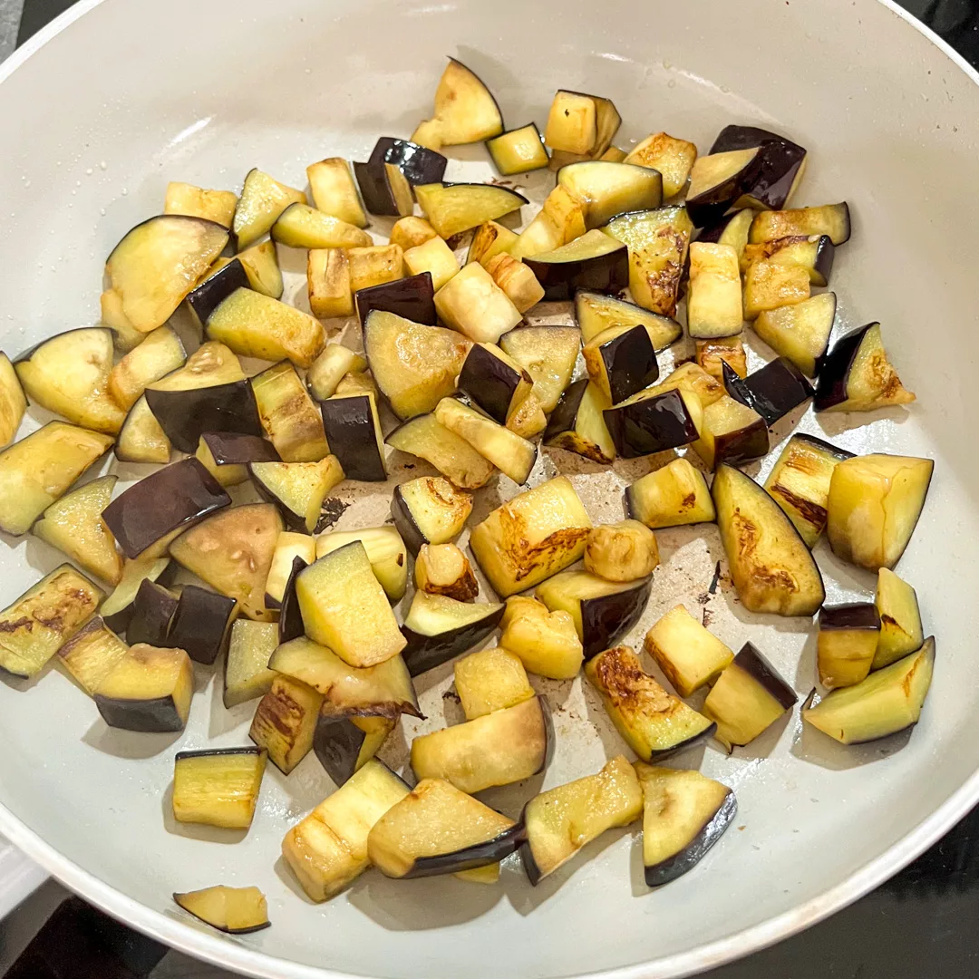 top view of skillet with grilled cubed eggplant