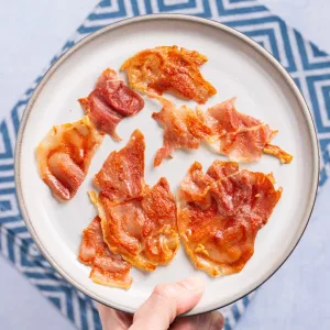birds eye view of a plate with small pieces of crisp prosciutto